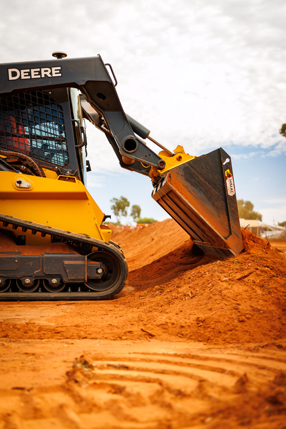 John Deere 331G compact track loader with bucket raised
