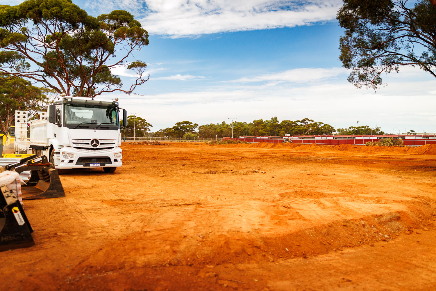 GEMS Civil equipment and tipper on a cleared commercial site