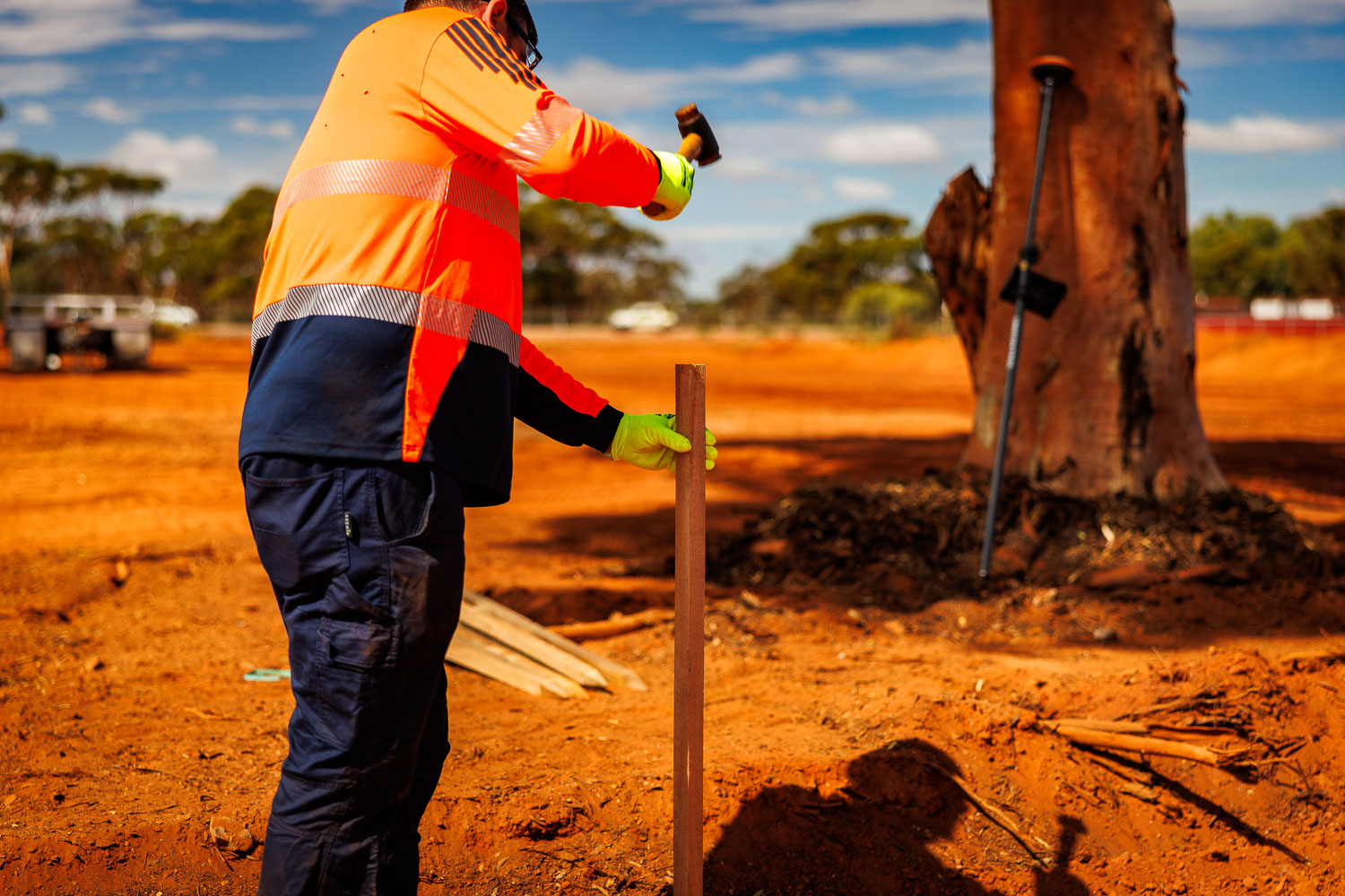 GEMS Civil operator driving survey stakes for property maintenance